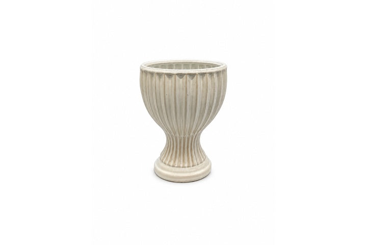 Decorative ribbed vase on a white background
