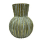 Decorative vase with ribbed texture on a white background