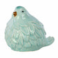 A glossy teal porcelain bird figurine with a matte beak and feet.