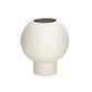 A matte white ceramic round vase with an embossed column and stripe design on the base.