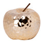 Decorative apple-shaped candle on a white background