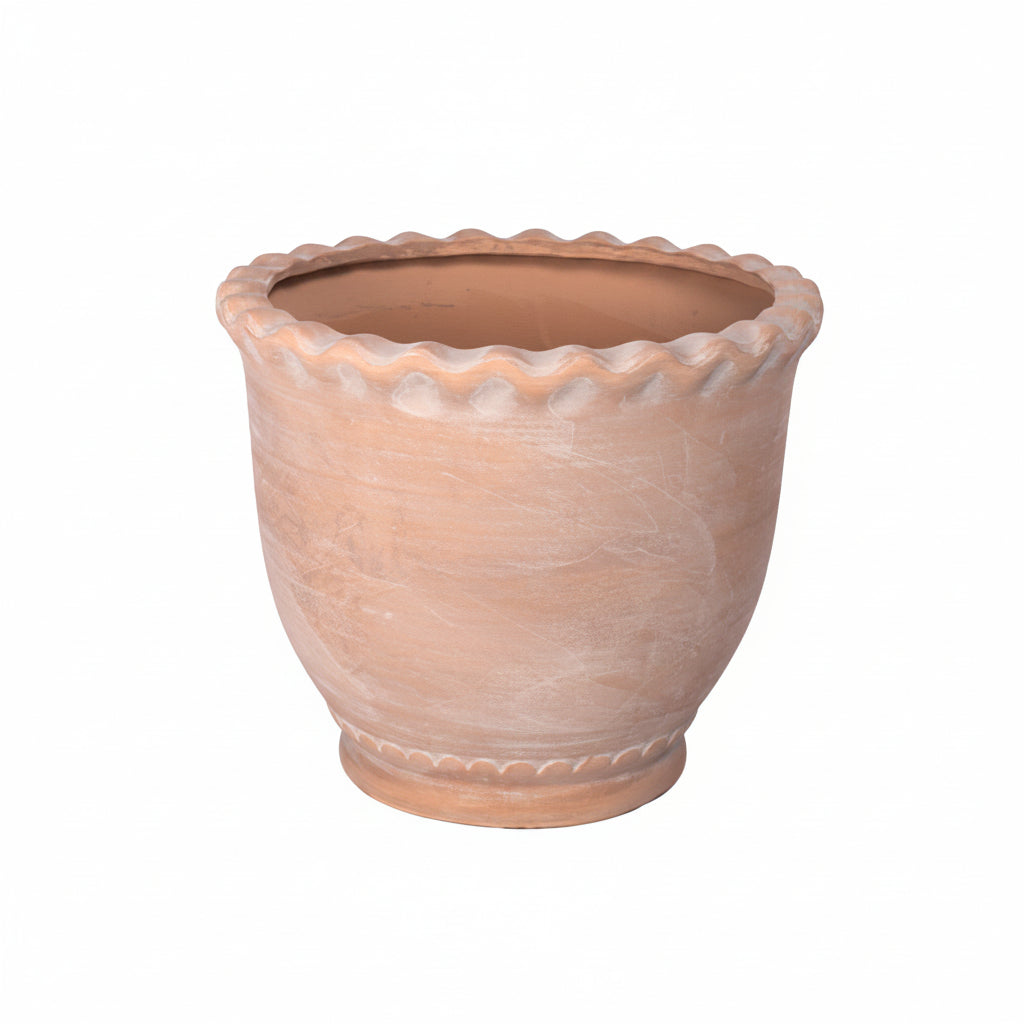 Terracotta pot with textured surface on a white background
