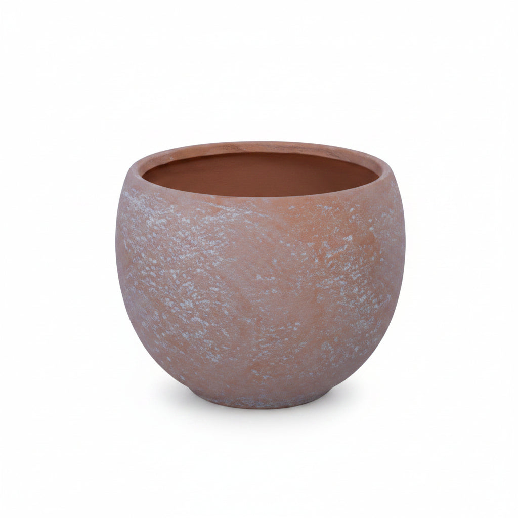 Round terracotta pot on a white background