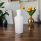 White ceramic vase on a white background