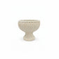 Beige textured vase on a white background