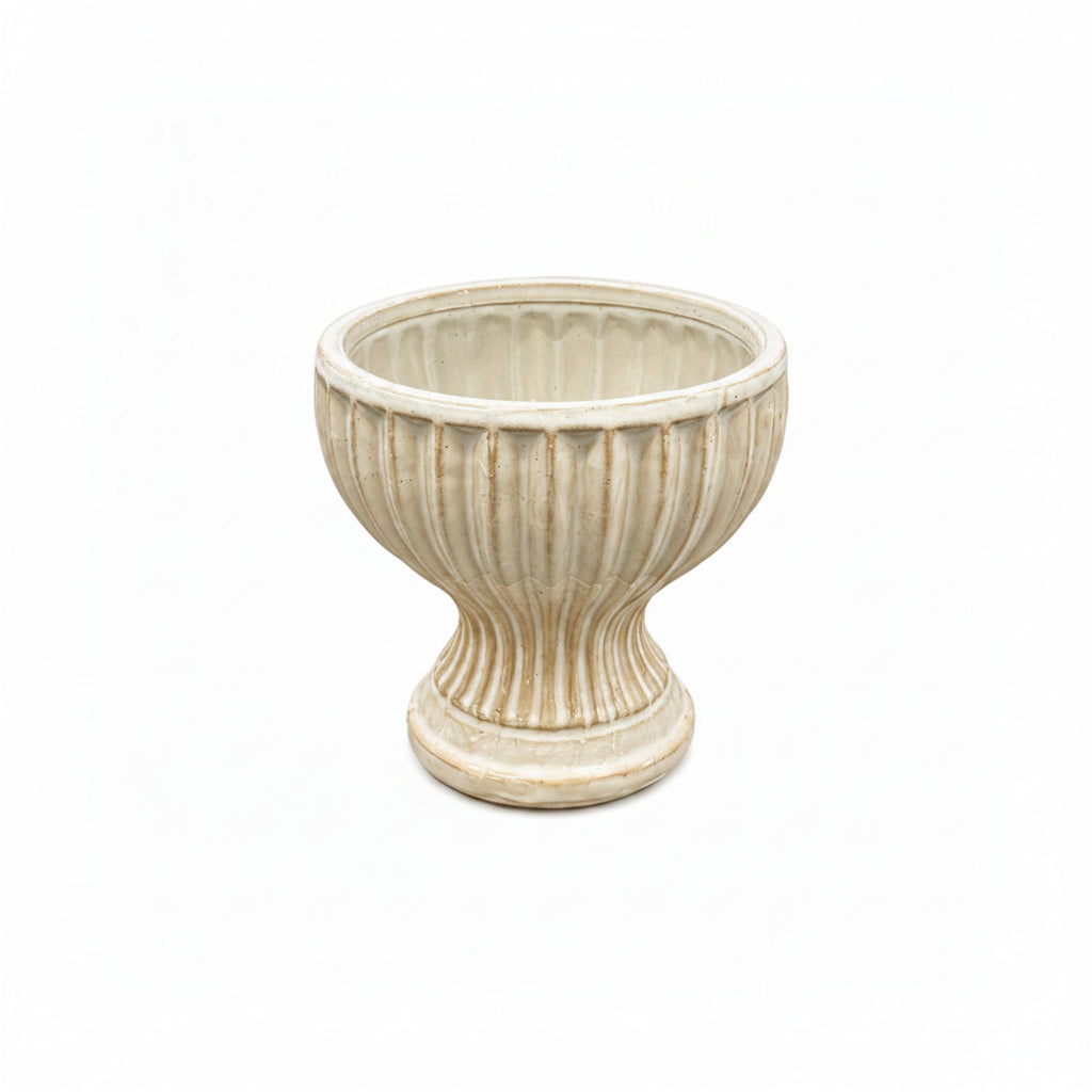 Off White ceramic planter with ribbed texture on a white background