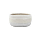White ceramic bowl with textured design on a white background