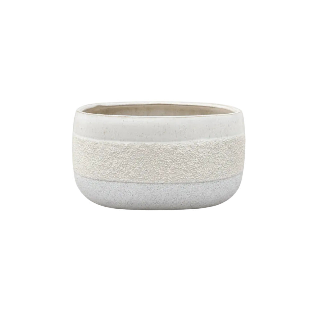 White ceramic bowl with textured design on a white background