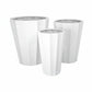 Set of three white planters of different sizes on a white background