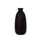 A black ceramic vase with a textured surface on a white background.