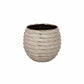 Textured ceramic pot on a white background