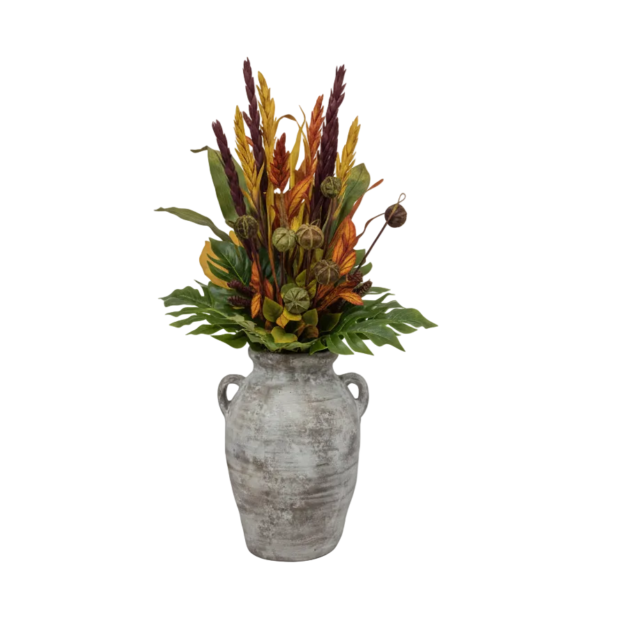 Decorative plant arrangement in a textured vase on a white background