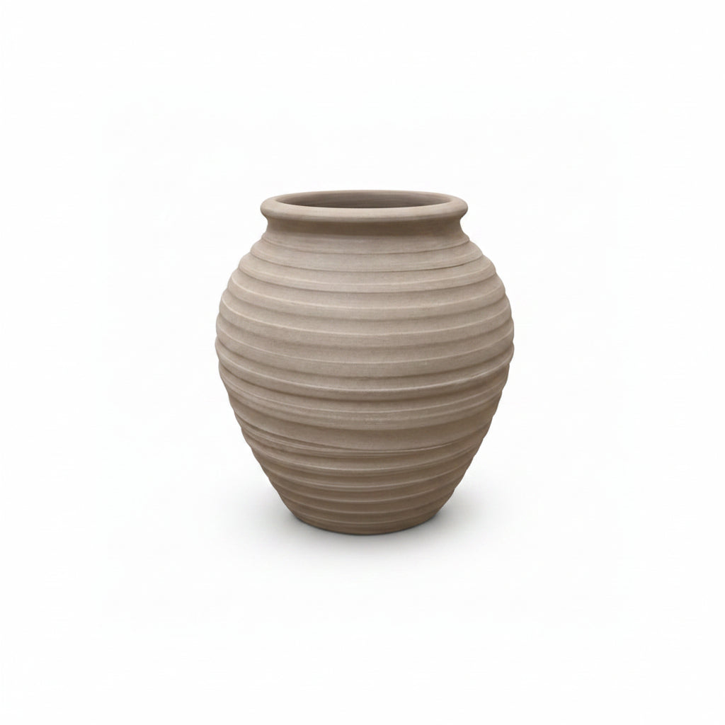 Beige ceramic vase with ribbed texture on a white background