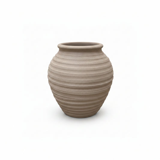 Beige ceramic vase with ribbed texture on a white background