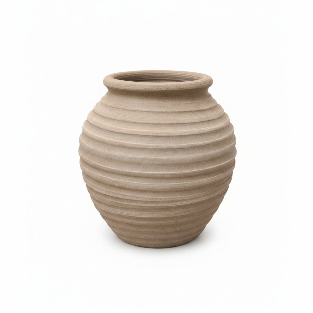 Beige ceramic vase with ribbed texture on a white background