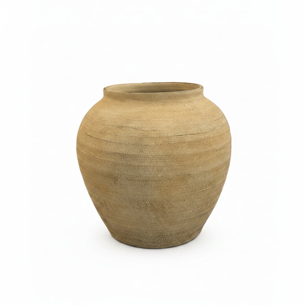 Textured beige vase on a white background