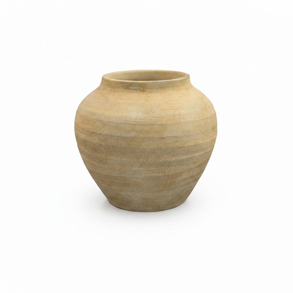 Beige ceramic vase on a white background
