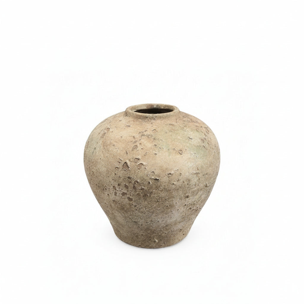 A rustic, textured ceramic vase with a rounded bulbous body and a short, slightly tapered neck, shown on a plain white background.