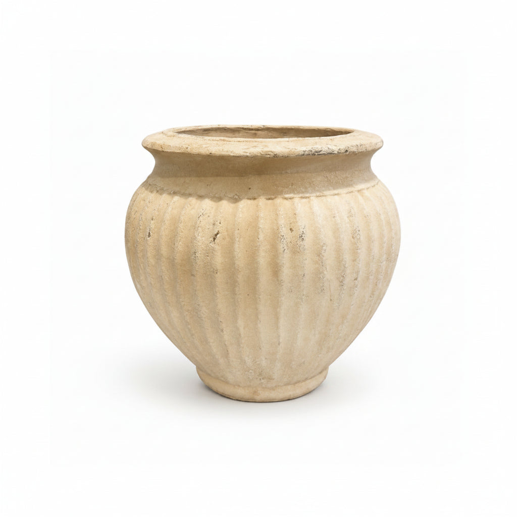An antique-style beige ceramic pot with a ribbed fluted texture and a wide rim, shown on a plain white background.