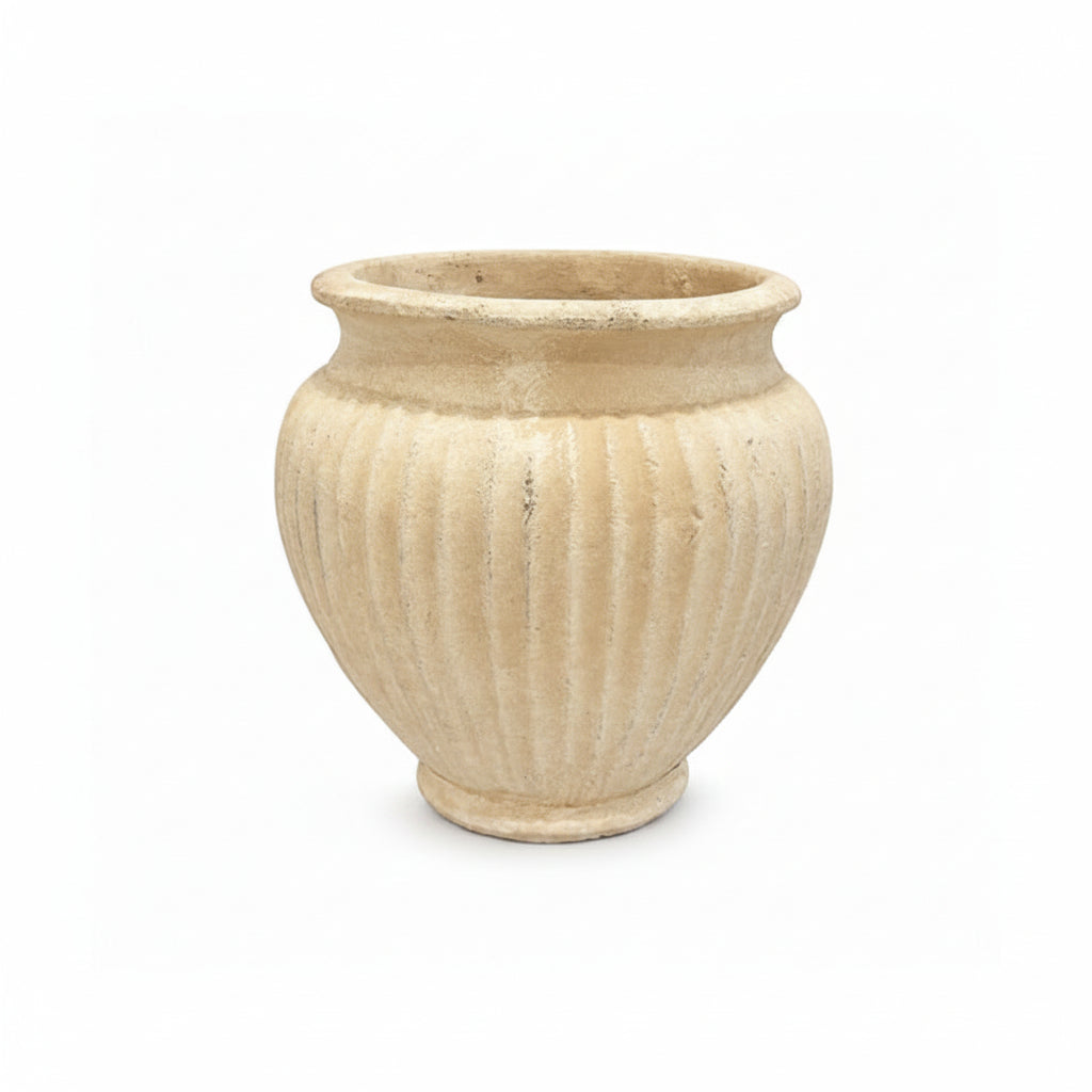 A small beige stone planter pot with a ribbed fluted texture and a wide rim, shown on a plain white background.