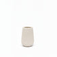 A small, textured ceramic vase in a warm off-white or cream color, photographed against a seamless white background.