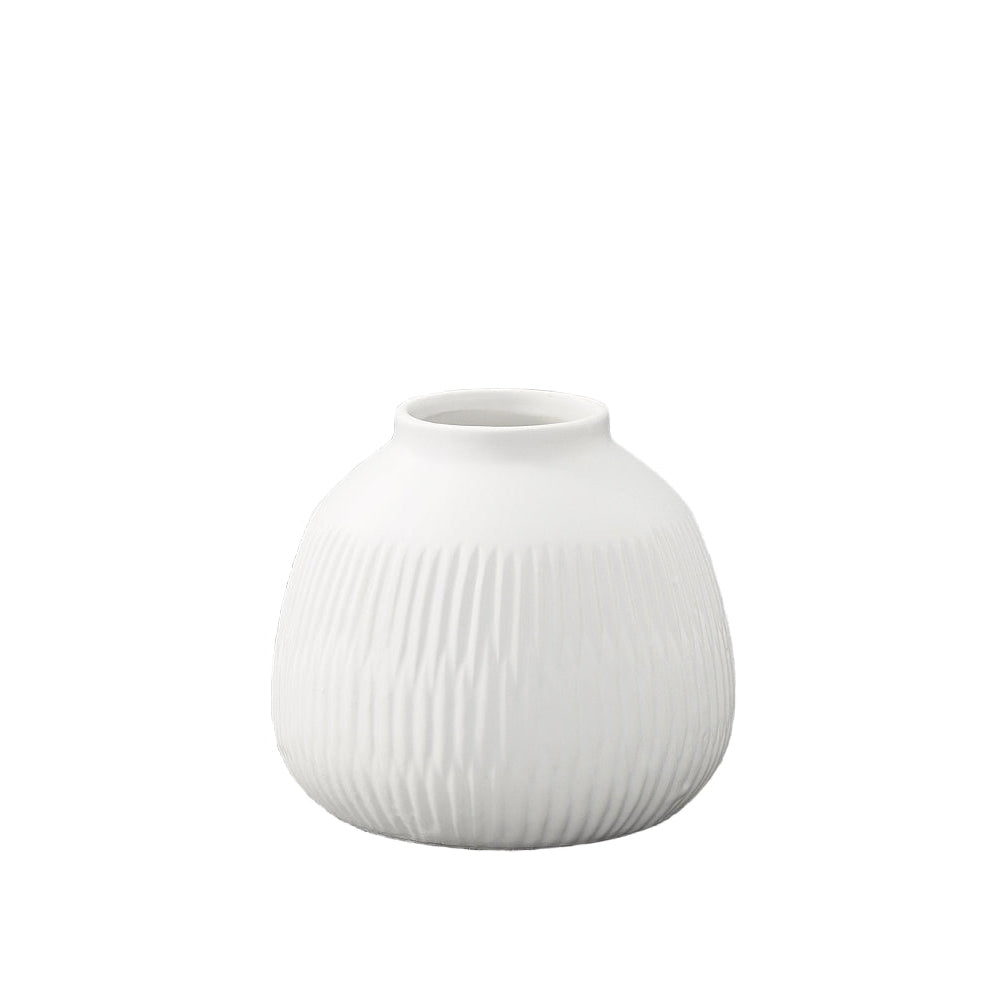 A matte finish white porcelain round vase with a geometric pattern design and a top wide entry.