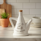 Jamaica Ceramic 24 oz. Olive Oil Pourer with Embossed Olives, Label, Cork Lid, and Handle