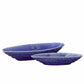 Two blue ceramic bowls on a white background