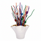 White vase with gold rim holding colorful artificial branches on a white background