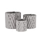 Set of three silver textured metal planters on a white background