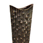 A ceramic oval vase with a geometric embossed rectangular design body and a tapered bottom, displayed in a distressed finish black color.