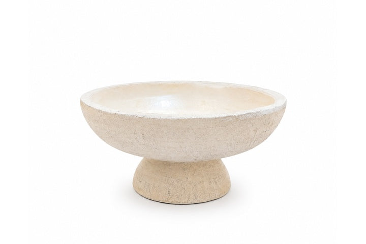Beige ceramic bowl on a white background