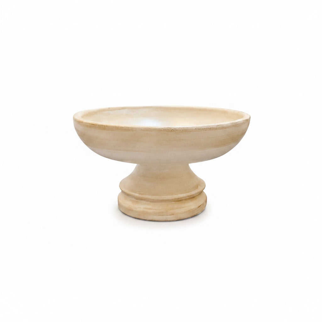 Beige ceramic bowl on a white background