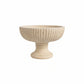 Beige textured bowl on a white background