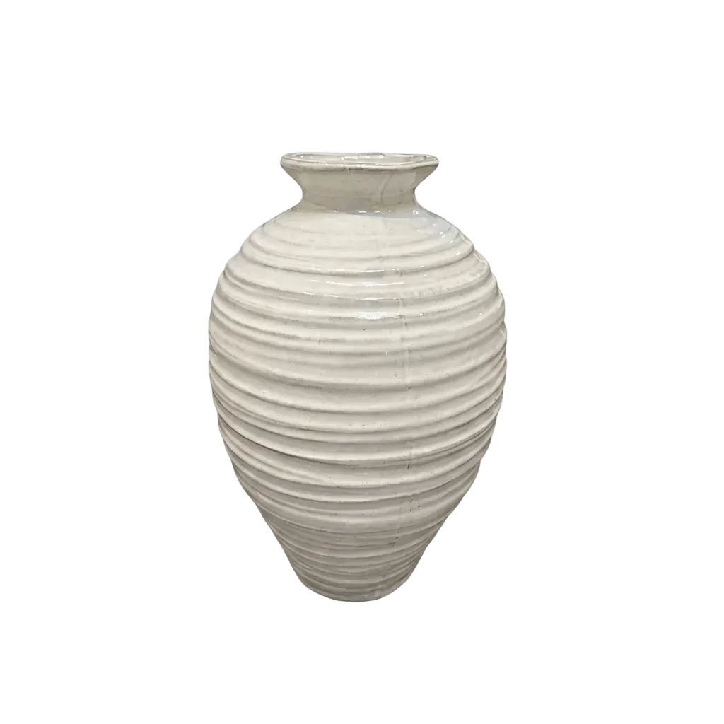 A ribbed ceramic vase with a flared rim, featuring a textured off-white glaze and a subtle gray shadow on a plain white background.