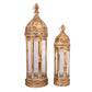 Two cylindrical metal lanterns with white and gold coloring, featuring glass panels and decorative elements.