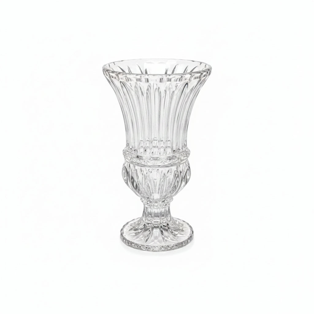 A clear cut-crystal pedestal cup or goblet with vertical fluting and a faceted base, shown on a plain white background.